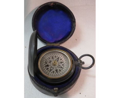 A magnetic pocket compass, the outer case marked TOVEY BATH, (diameter 4.5cm), in a velvet lined fitted box