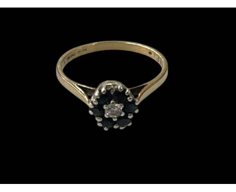 18 carat gold, sapphire and diamond claw set ring, size O.
