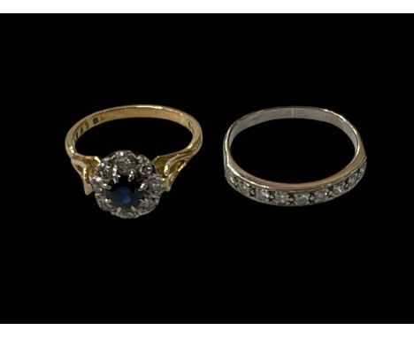 18 carat yellow gold, sapphire and diamond cluster ring and white gold nine stone diamond half eternity ring, sizes O & Q.