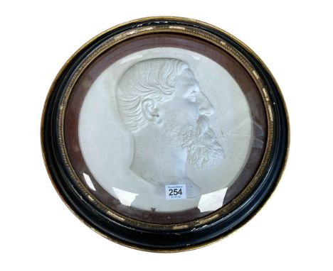 19th Century plaster portrait bust of gentleman in port hole style frame with convex glass, 42cm diameter.