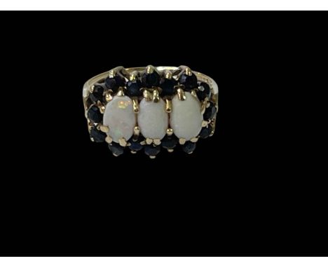 9 carat yellow gold sixteen stone sapphire and three stone opal ring, size I.