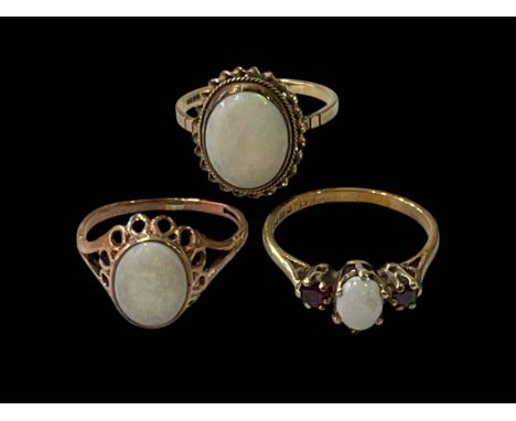 Three 9 carat gold opal set rings, all size O.