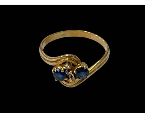 Sapphire and diamond twist design ring set in yellow unmarked gold (18ct ?), size V.
