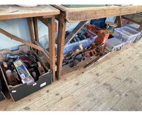Collection of tools including chisels, planes, saws, etc.