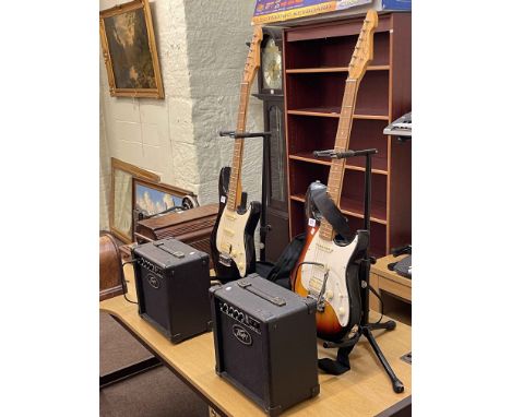 Two Peavey Raptor guitars and two amps.