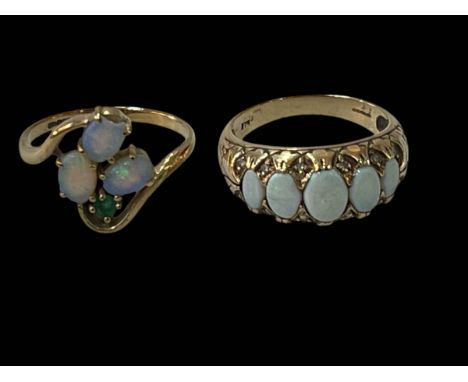 Two opal set 9 carat gold rings, both size P.