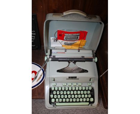 A CASED VINTAGE TYPEWRITER