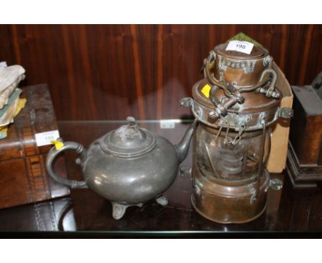A VINTAGE BRASS LANTERN TOGETHER WITH A PEWTER TEAPOT (2)