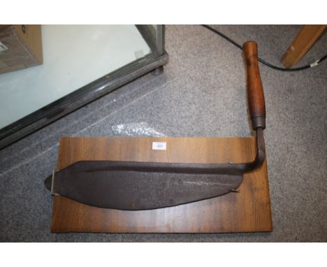 A VINTAGE SCYTHE ON WALL MOUNTABLE OAK PANEL 