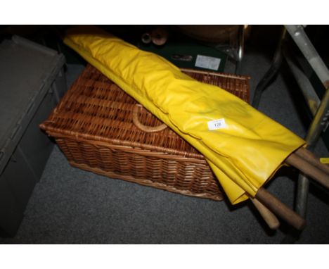 A VINTAGE CORNETTO WIND BREAK TOGETHER WITH A WICKER PICNIC BASKET & CONTENTS