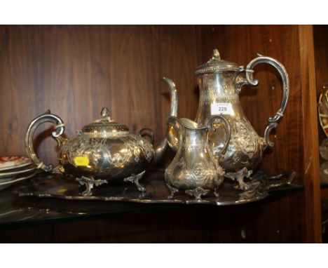 A SILVER PLATED TEA SERVICE ON A SILVER PLATED TRAY