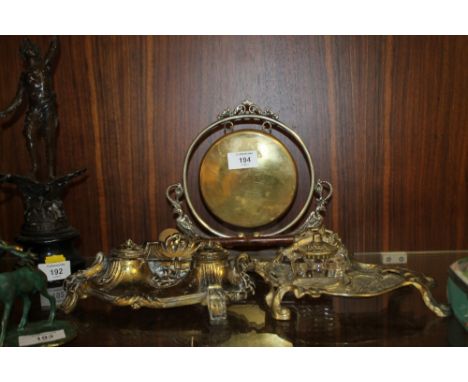 A BRASS TWIN INKWELL TOGETHER WITH ANOTHER AND A SMALL TABLE GONG (3)