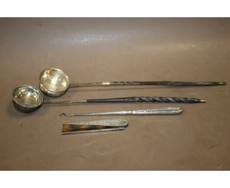 TWO GEORGIAN WHALE BONE HANDLED LADLES, A SILVER BUTTON HOOK AND A FOLDING SILVER COMB (4)