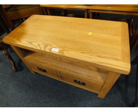 A MODERN LIGHT OAK TELEVISION CABINET