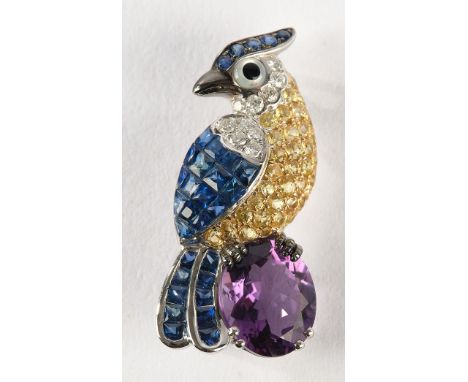 Anhänger/Brosche, WG 750, 10 Brillanten zus. ca. 0.15 ct., etwa w/vs1-si, 1 Amethyst ca. 2.60 ct., 66 blaue und gelbe Saphire