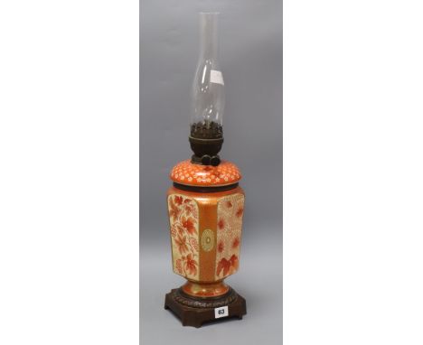 A late Victorian Oriental style pottery oil lamp H.66cm