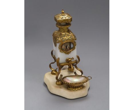 A French 19th century 'Palais Royal' style gilt brass and white opaline glass eau de toilette stand, fitted with a square sec