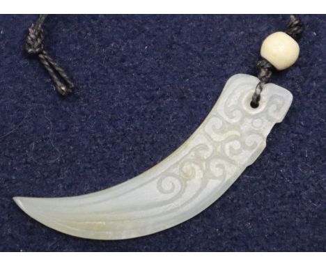 A jade tooth pendant