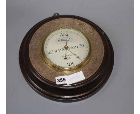 A Negretti &amp; Zambra plate mounted oak aneroid barometer