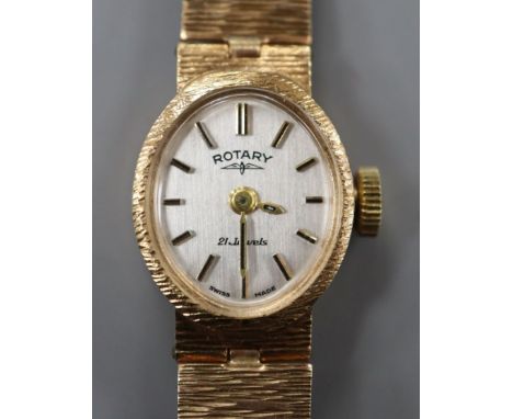 A lady's Rotary 9ct gold wristwatch on textured bracelet.