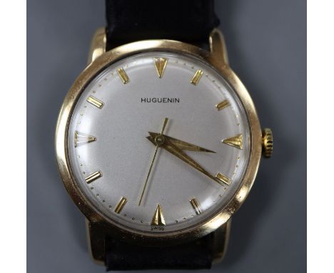 A gentleman's 14k Huguenin manual wind wrist watch, on associated leather strap.