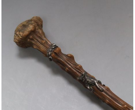 A late 19th century gnarled walking stick with white metal fox chasing a squirrel