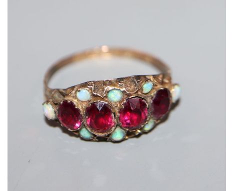 A late Victorian 9ct gold, ruby and opal half-hoop ring, Nathan Bros, Birmingham, size P.