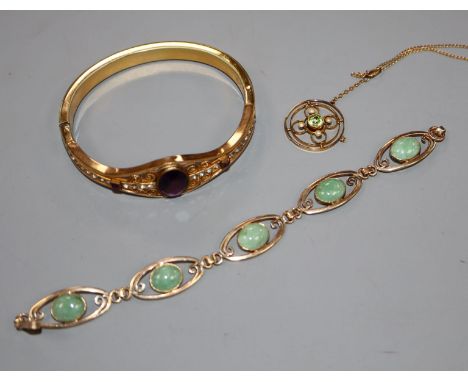 An early 20th century yellow metal, peridot and seed pearl pendant on chain, a 9ct gold and green cabochon bracelet and a pin