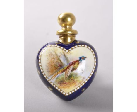 A WORCESTER HEART SHAPED PORCELAIN SCENT BOTTLE AND STOPPER, CIRCA. 1900, in the blue ground edged in gilt and painted with a