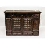 A 16TH-17TH CENTURY OAK HANGING CUPBOARD, with door and drawers with shaped interior. 3ft high x 4ft