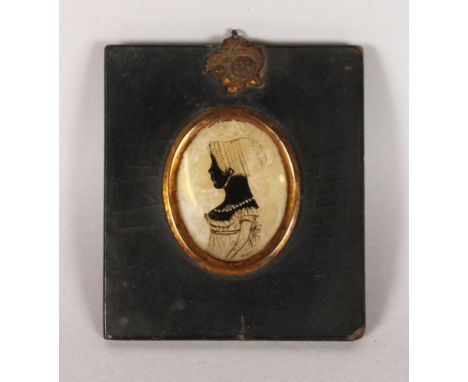 A GEORGIAN COLOURED WAX OVAL PORTRAIT OF A YOUNG GIRL. 2ins x 1.5ins, framed.