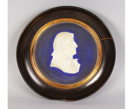 A LARGE BLUE AND WHITE PORCELAIN CAMEO PORTRAIT OF A MAN. 5.5ins diameter.