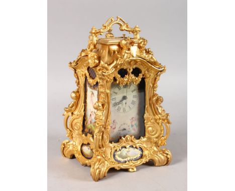 A SEVRES STYLE ORMOLU CARRIAGE CLOCK, with decorative porcelain panels. 9ins high.