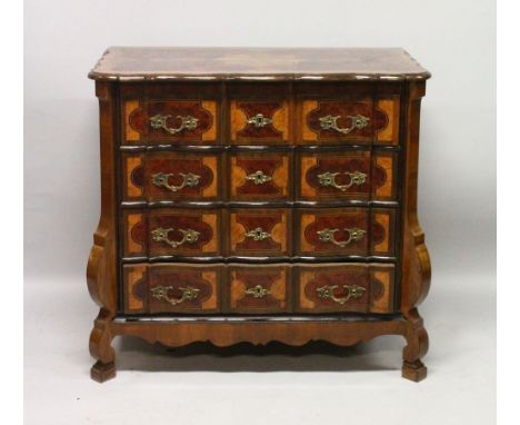 A LATE 19TH CENTURY CONTINENTAL WALNUT AND MARQUETRY FOUR DRAWER COMMODE, inlaid overall with geometric design, the drawers w