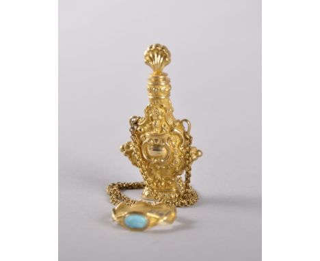 A SUPERB 18TH CENTURY GOLD PERFUME BOTTLE, stopper, chain and ring, the bottle decorated with scrolls, shells and lyre, the b