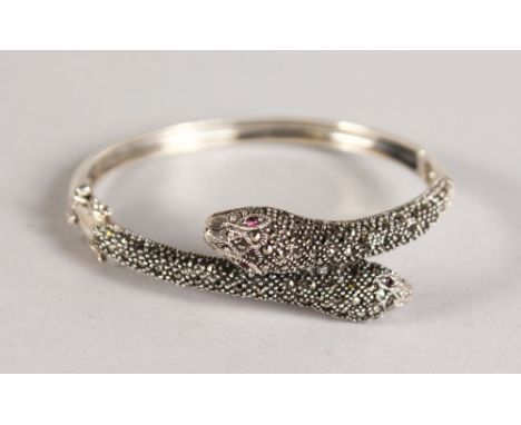 A SILVER MARCASITE SNAKE BANGLE.