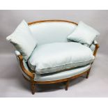 AN 18TH CENTURY FRUITWOOD CANAPE with curving back and arms, on tapering legs. 4ft 4ins long.