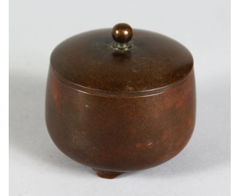 A CHINESE BRONZE CIRCULAR CENSER AND COVER, plain design on bracket feet. 2.75ins diameter.