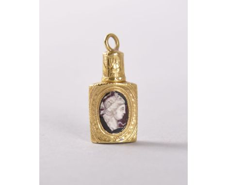 A LOUIS XVI MINIATURE GOLD OVAL SHAPED PERFUME BOTTLE, each side inset with a portrait of a young lady and man.  2.5cms. Prov
