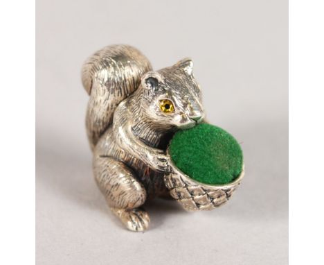 A NOVELTY SILVER SQUIRREL PIN CUSHION.