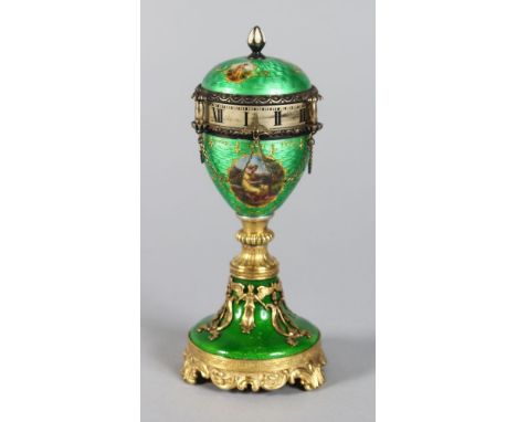 A SUPERB RUSSIAN "FABERGE" MODEL ENAMEL URN SHAPED CLOCK, the top with three small oval classical enamel portraits, below a b