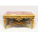 AN IMPRESSIVE LOUIS XVI STYLE GILTWOOD AND MARBLE TABLE, with rouge marble inset top, pierced and