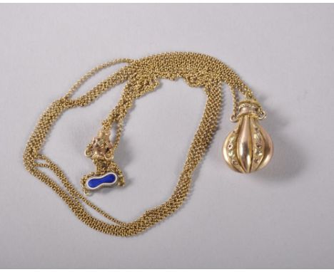 A SMALL 19TH CENTURY THREE COLOUR GLASS PERFUME BOTTLE, CIRCA. 1850, on a gold chain with enamel fastener.