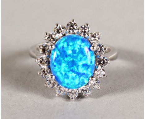 A BLUE OPAL AND BRILLIANT SET CLUSTER RING.