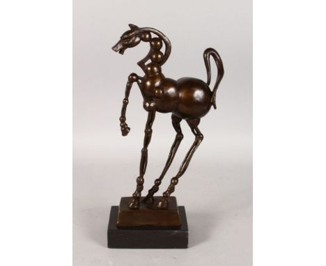 AFTER SALVADOR DALI A PRANCING BRONZE HORSE. Signed Dali, on a black marble base.  13ins high.