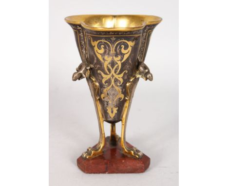 A RARE BRONZE AND SILVER TREFOIL CUP with three squirrel mounts on curving claw feet, 6ins high, with triangular marble base.
