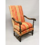 A 17TH CENTURY ITALIAN CARVED WALNUT ARMCHAIR with padded back and seat, with carved arms and barley