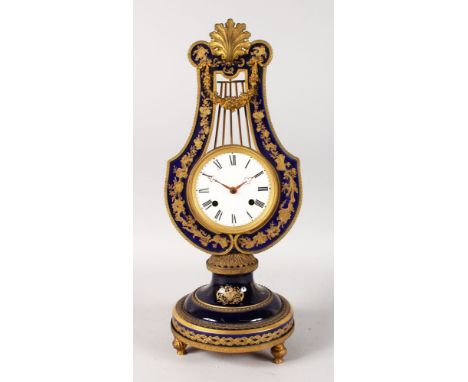 A LOUIS XVI STYLE BLUE LYRE CLOCK, with gilt inlay and mounts, circular dial with black Roman numerals and eight-day movement