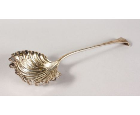 A LADLE with shell bowl. Sheffield 1928.