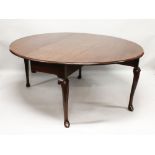A GOOD GEORGE III MAHOGANY OVAL DROP FLAP GATE-LEG DINING TABLE, with plain top, on curving legs